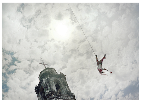 Photograph of someone swinging through the air, by Geoff Winningham