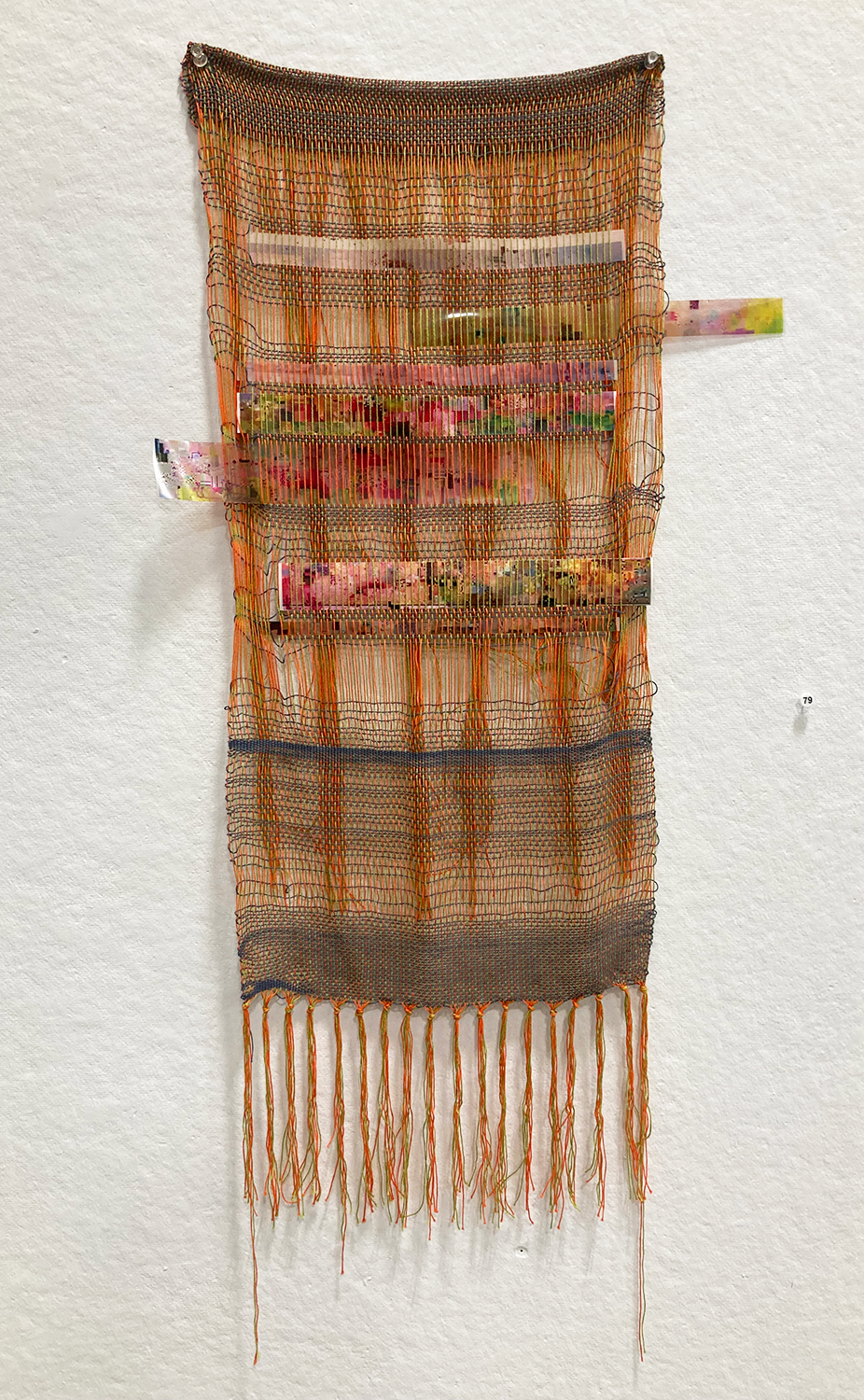 Brightly colored thread woven with celluloid film woven through it
