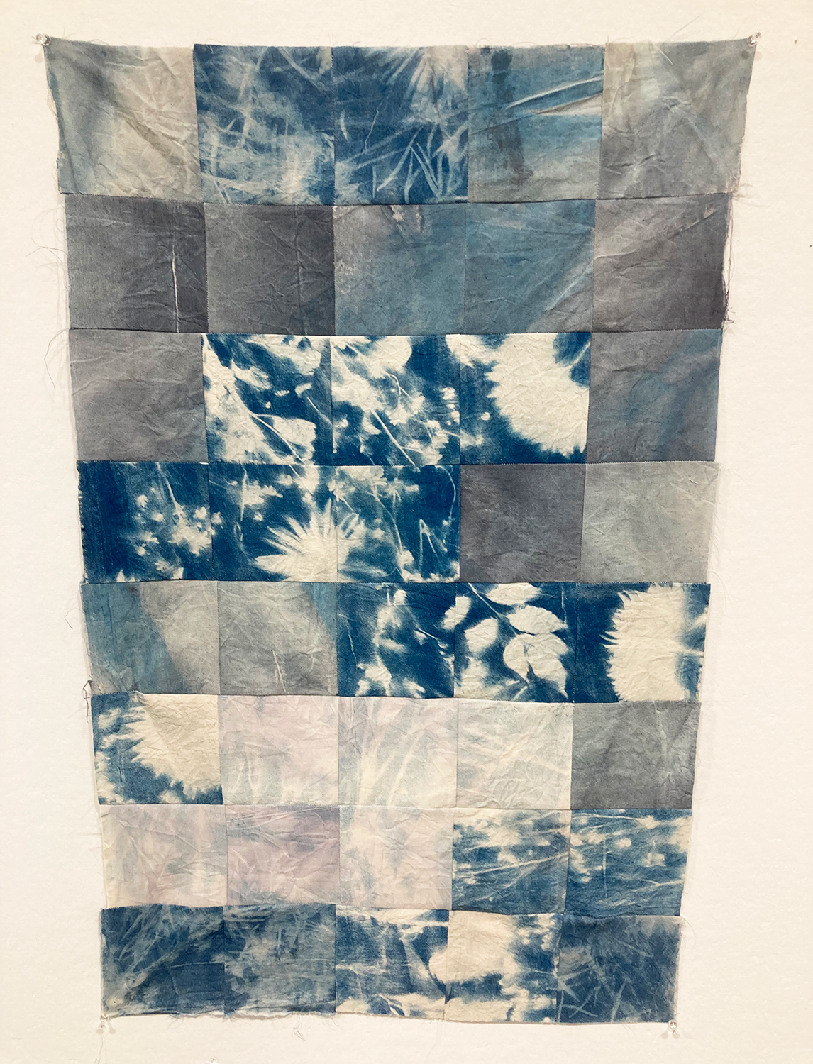 Cotton cyanotype squares quilted together