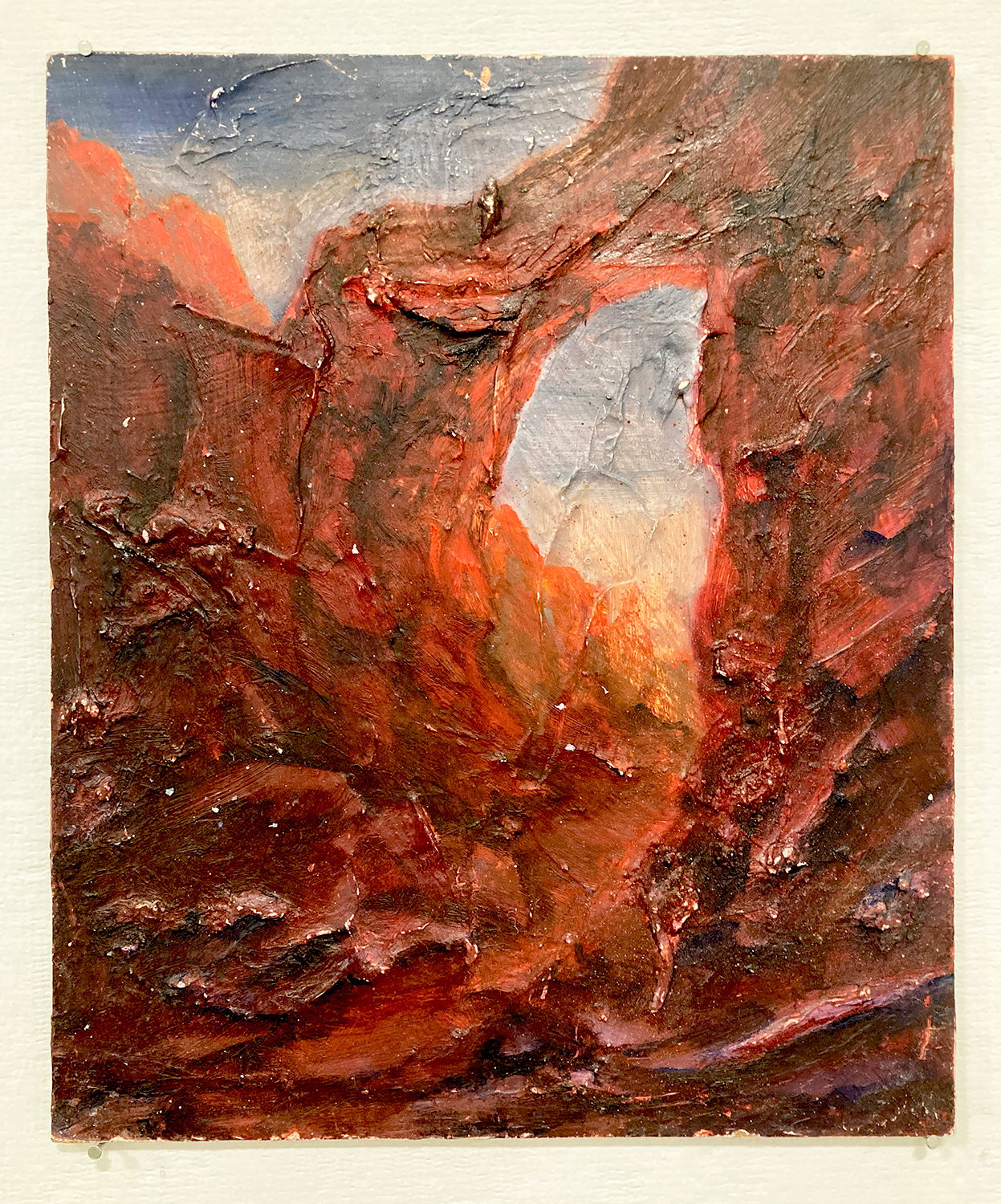 Painting of a landscape with rich red and orange colors