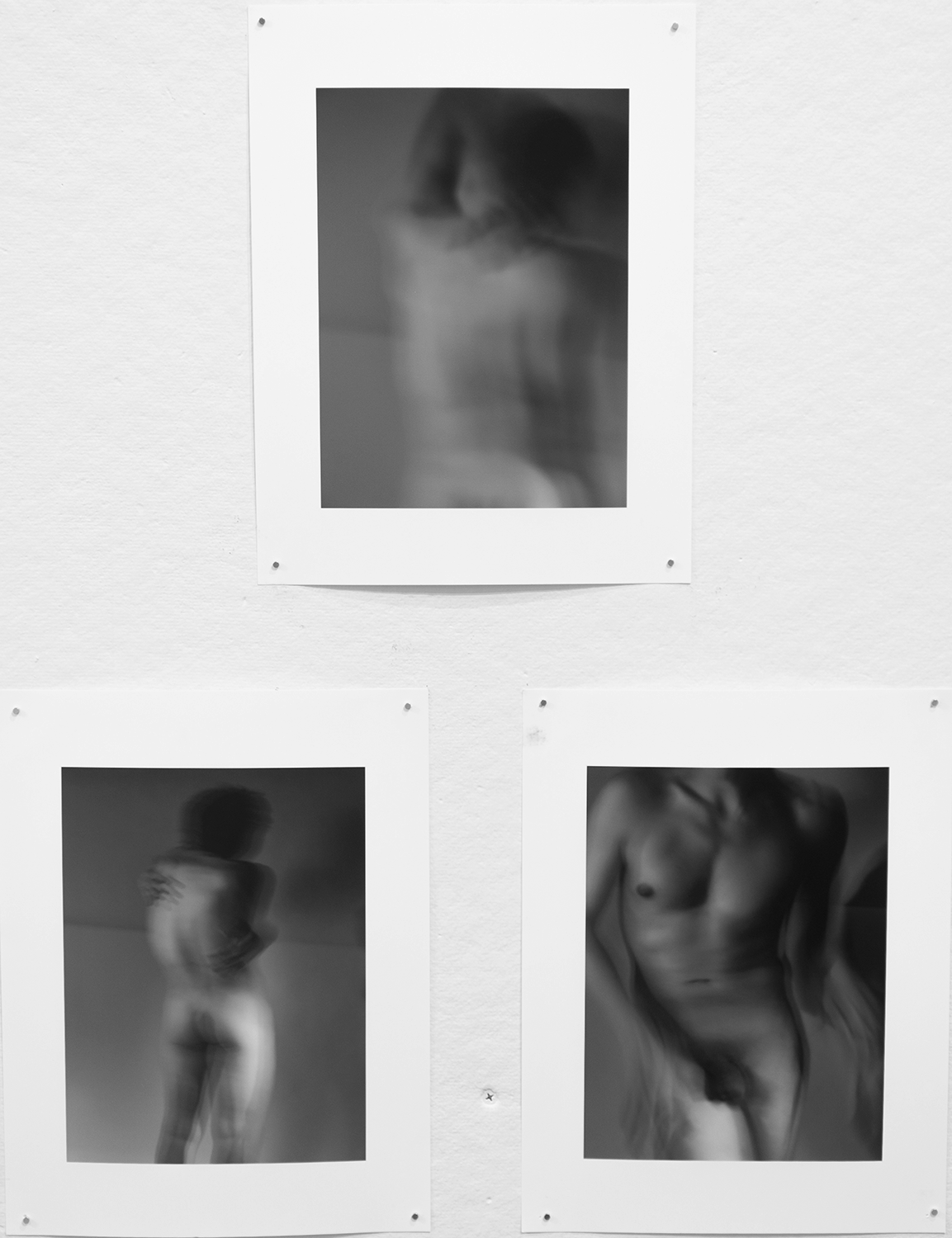 three black and white photographs of a body in different positions of motion