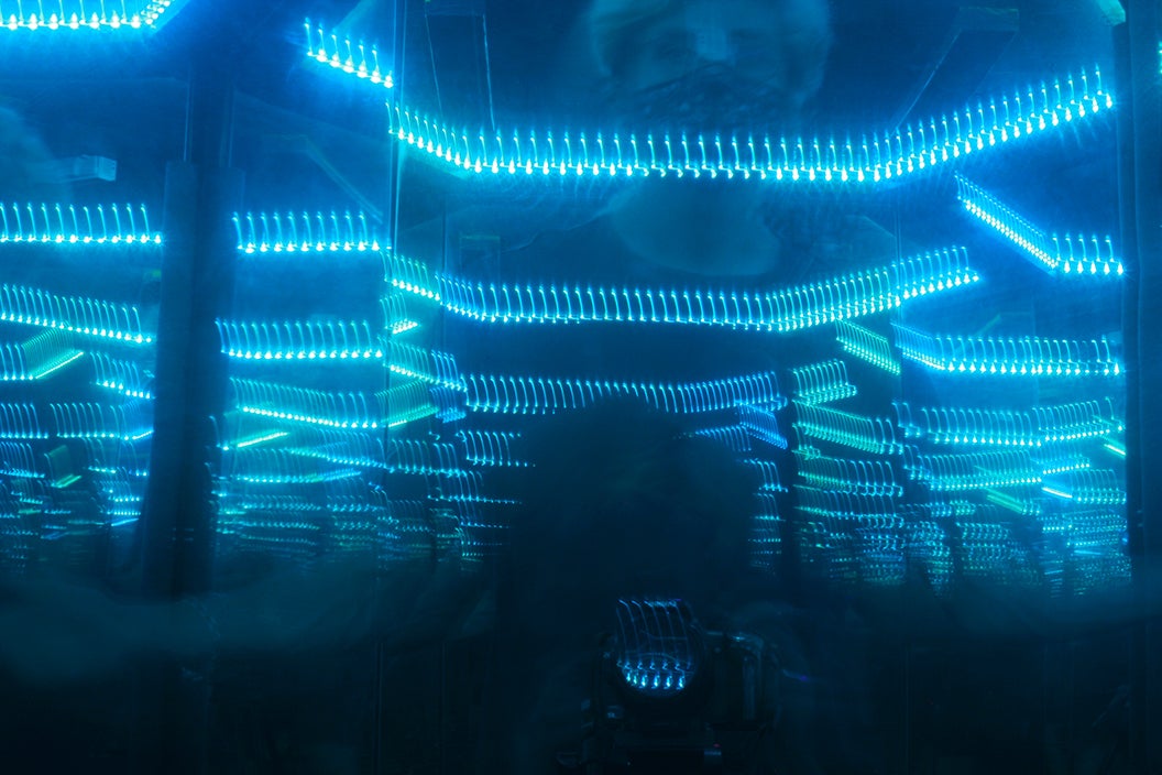 Image of interior lit, mirrored chamber. 