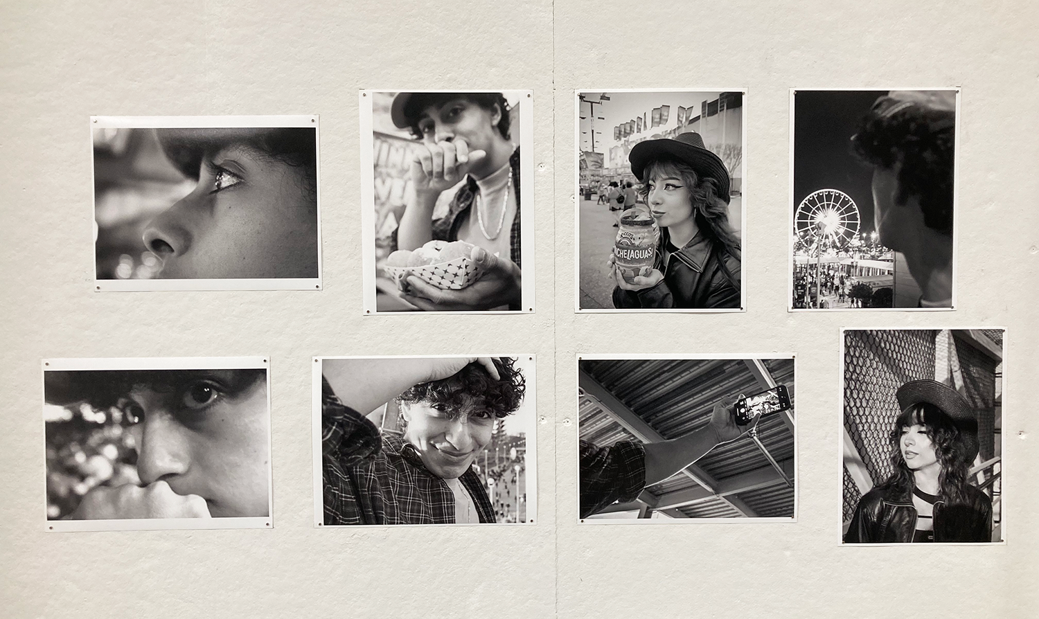 A group of eight black and white photographs of a young couple at a fair