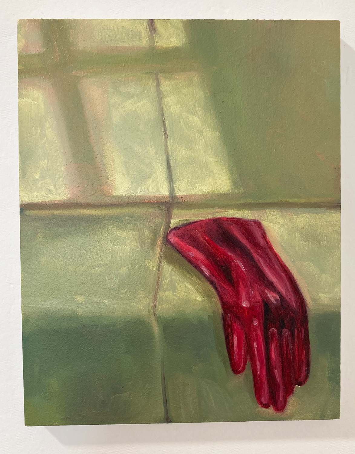 Oil painting of a red glove on a green sofa (or seat)
