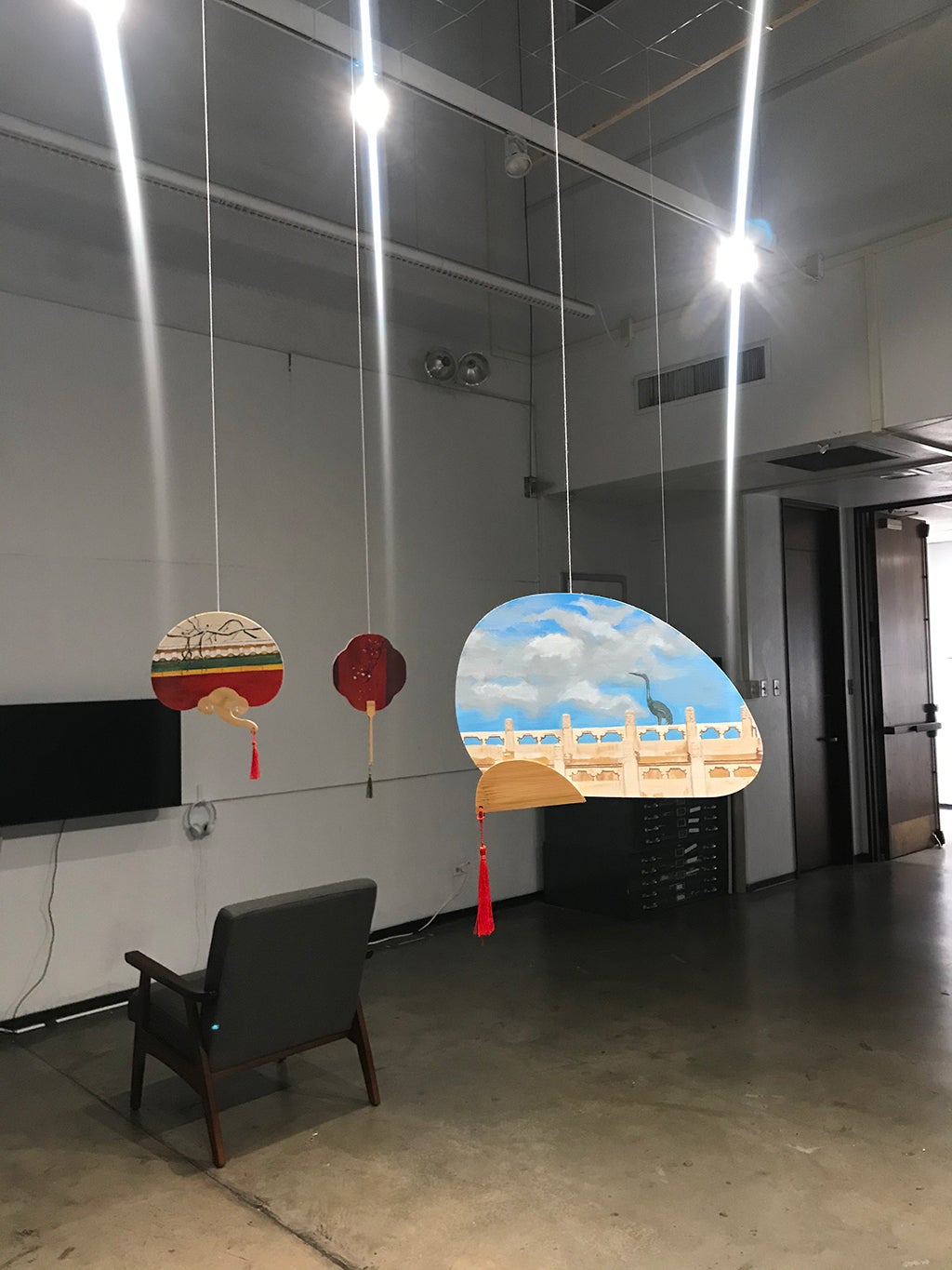 Image of fan with painted landscape.