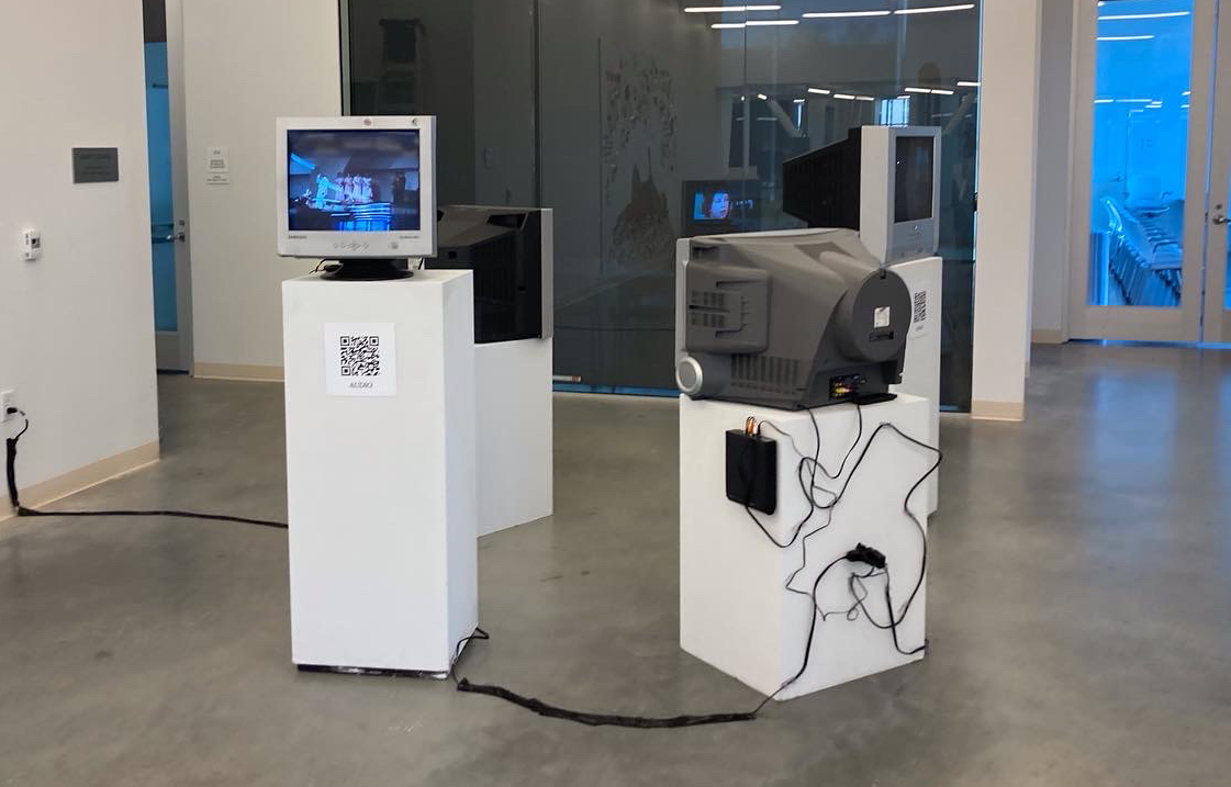 Image of monitors arranged in a circular pattern; project by Lily Weeks.