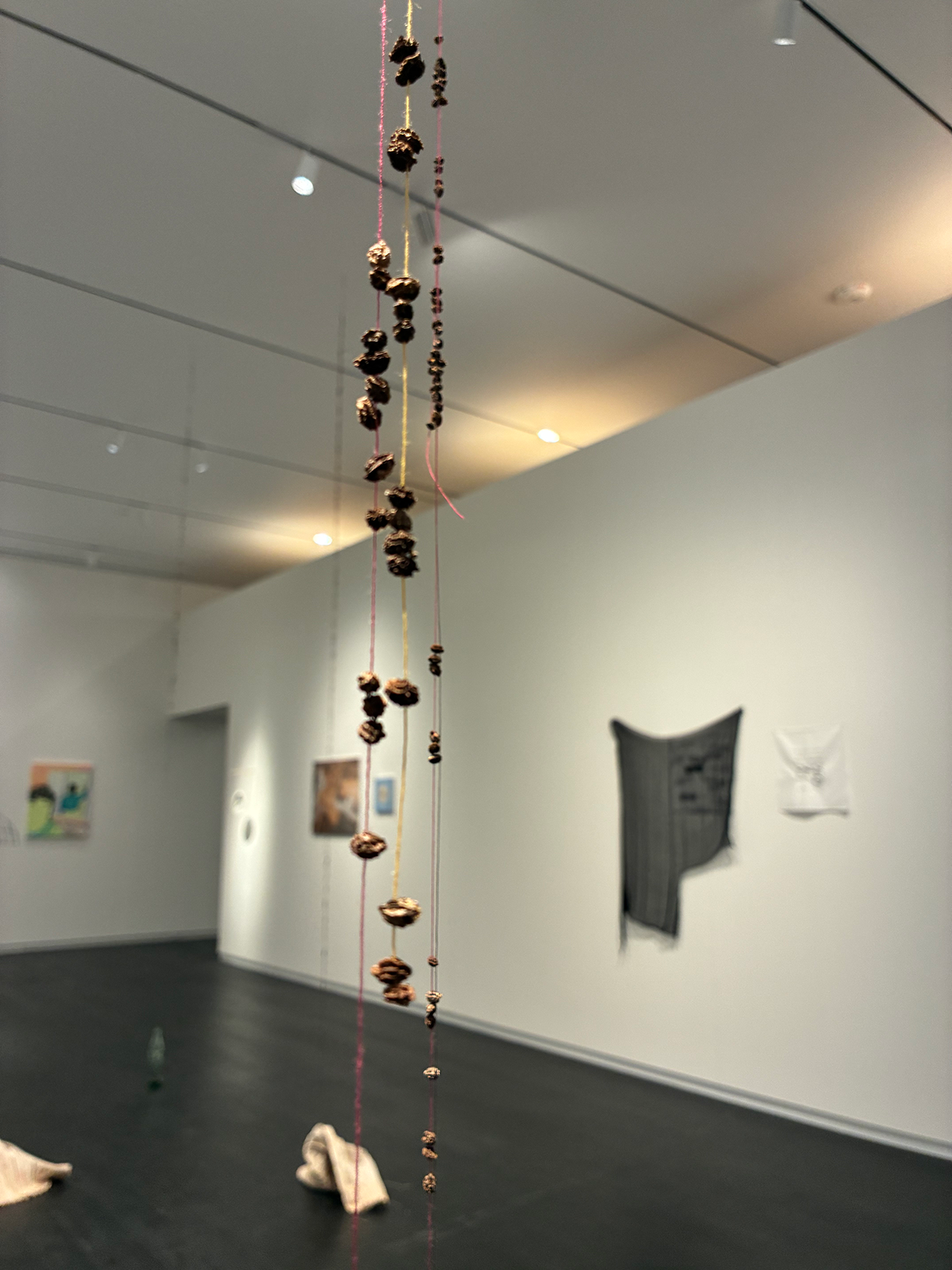 Soft sculpture of dyed, gathered, and shaped canvas, "Untitled (Mendings & loose ends)" by Madeline Ansley, also includes Mexican Coke bottles, sewing thread, dried papaya seeds, and "I feel the ebbs and flows within my limbs", raw canvas, thread, acrylic paint, acrylic retarder, silver leaf