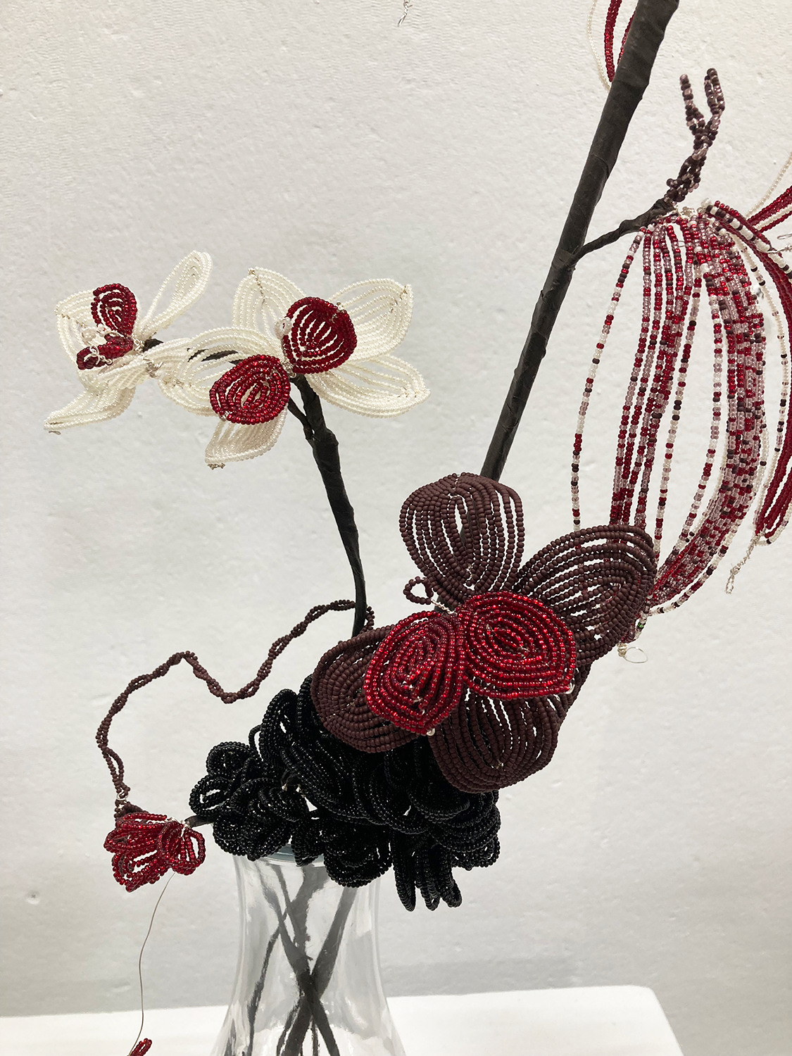Close up of flowers made of glass seed beads