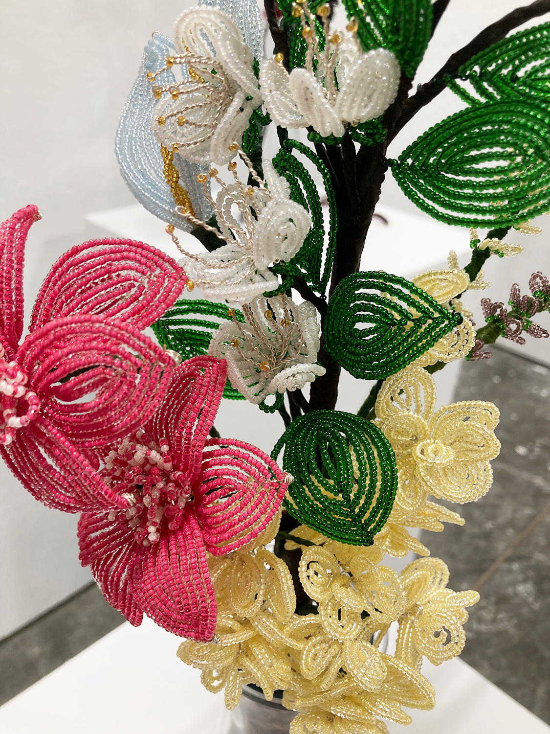 Close up of flowers made of seed beads