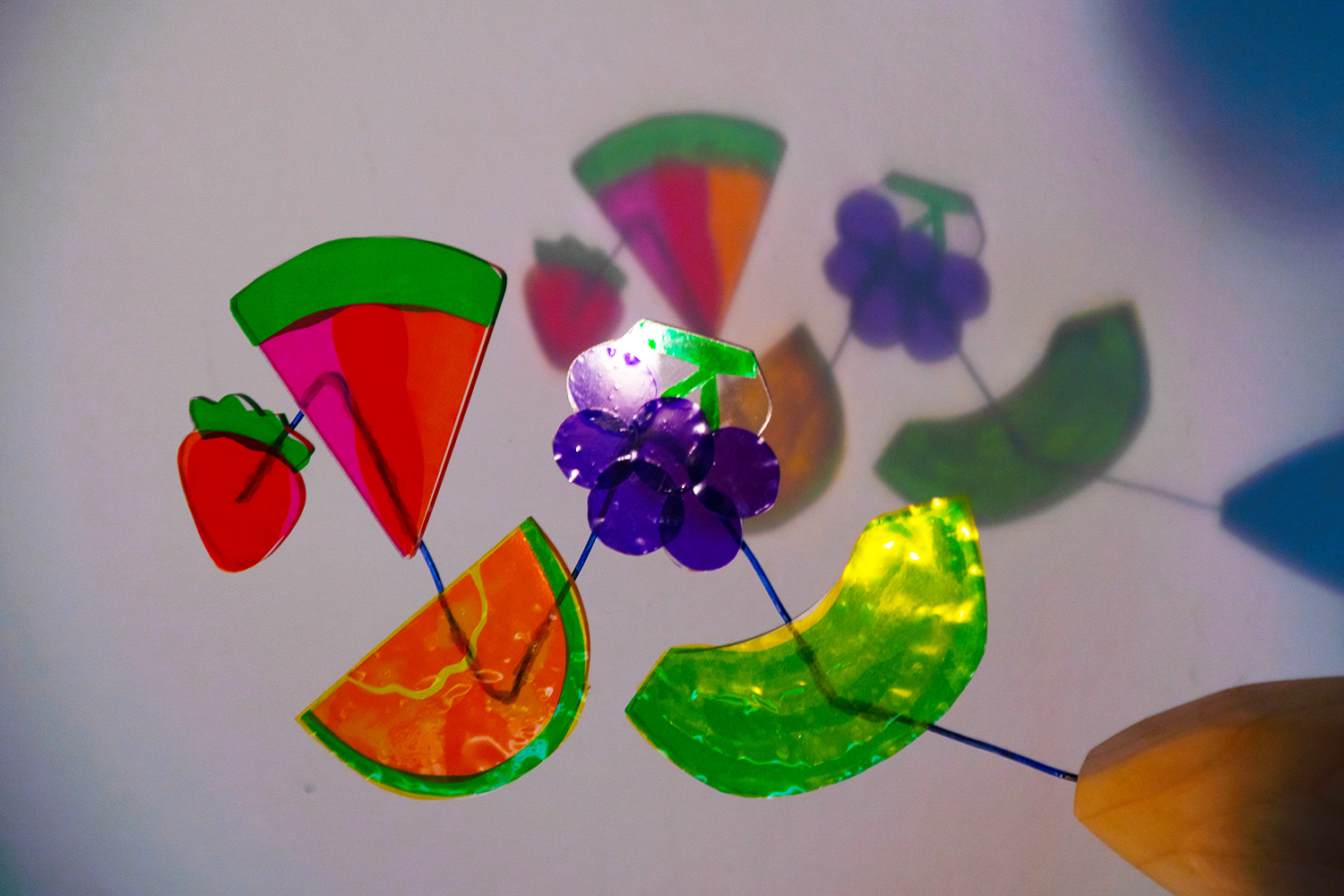 colored plastic cut into pieces of fruit