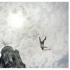 Photograph of someone swinging through the air, by Geoff Winningham